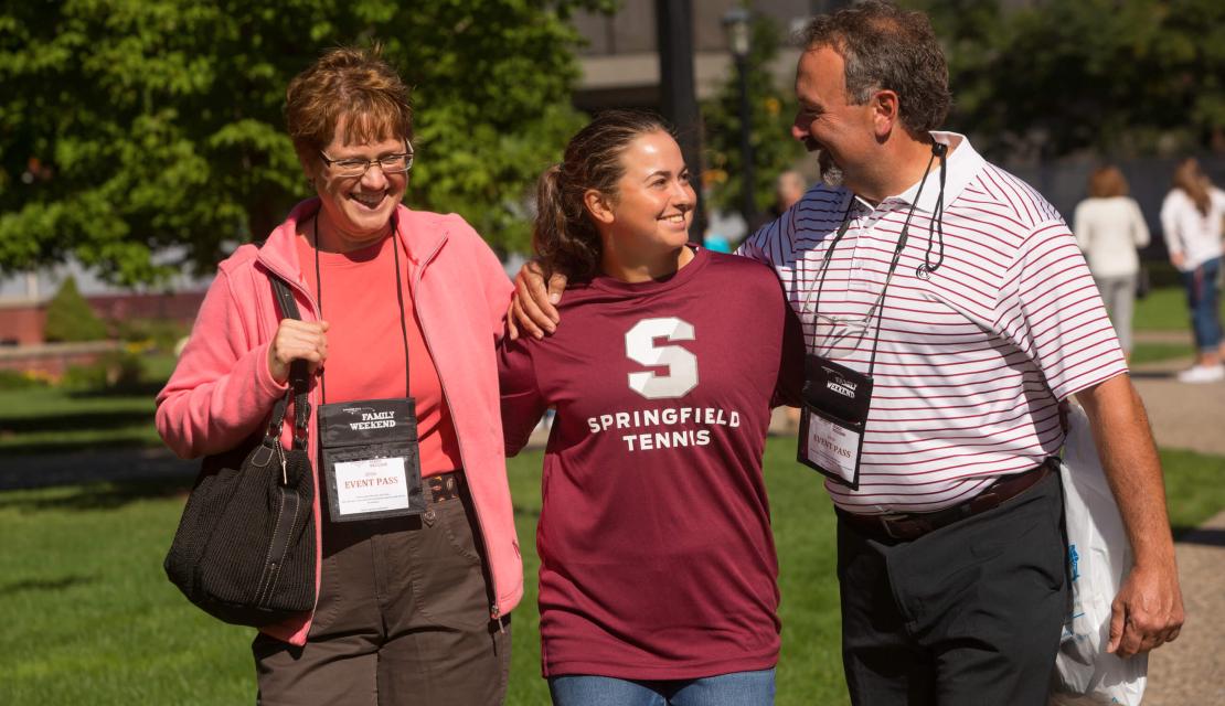 A student and her parents at Family Weekend. 