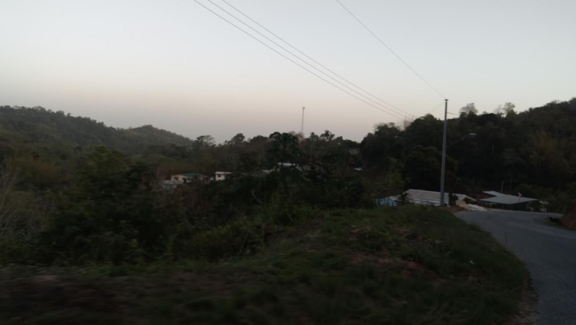 A narrow road in Trinidad at dusk. 