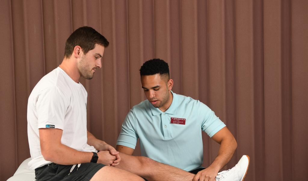 Springfield College physical therapy student Xavier Gibson participates in a lab 
